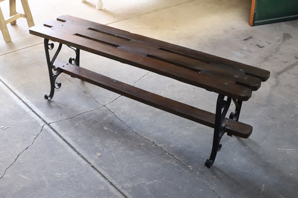 Lot 70 - TEAK AND IRON BENCH