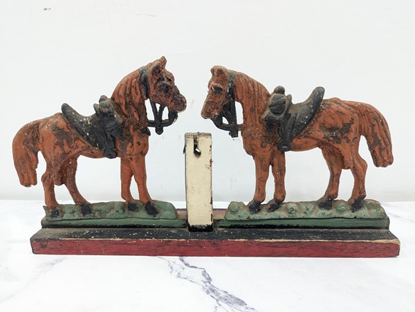 Lot 1425 - CAST IRON HORSES