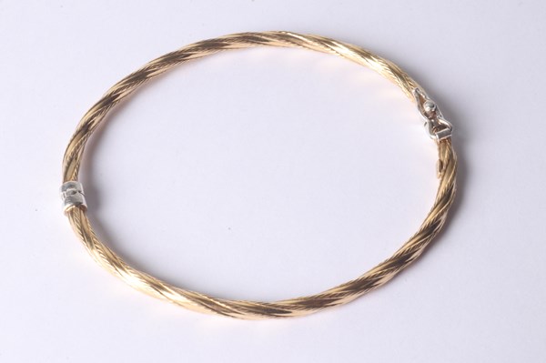 Lot 1011 - GOLD PLATED BANGLE