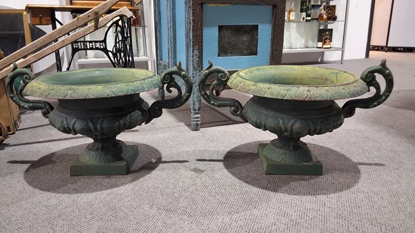 Lot 425 - CAST IRON URNS