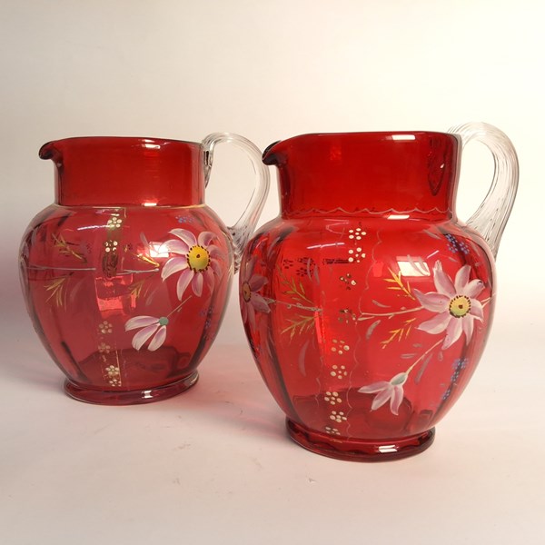 Lot 1258 - CRANBERRY GLASS JUGS